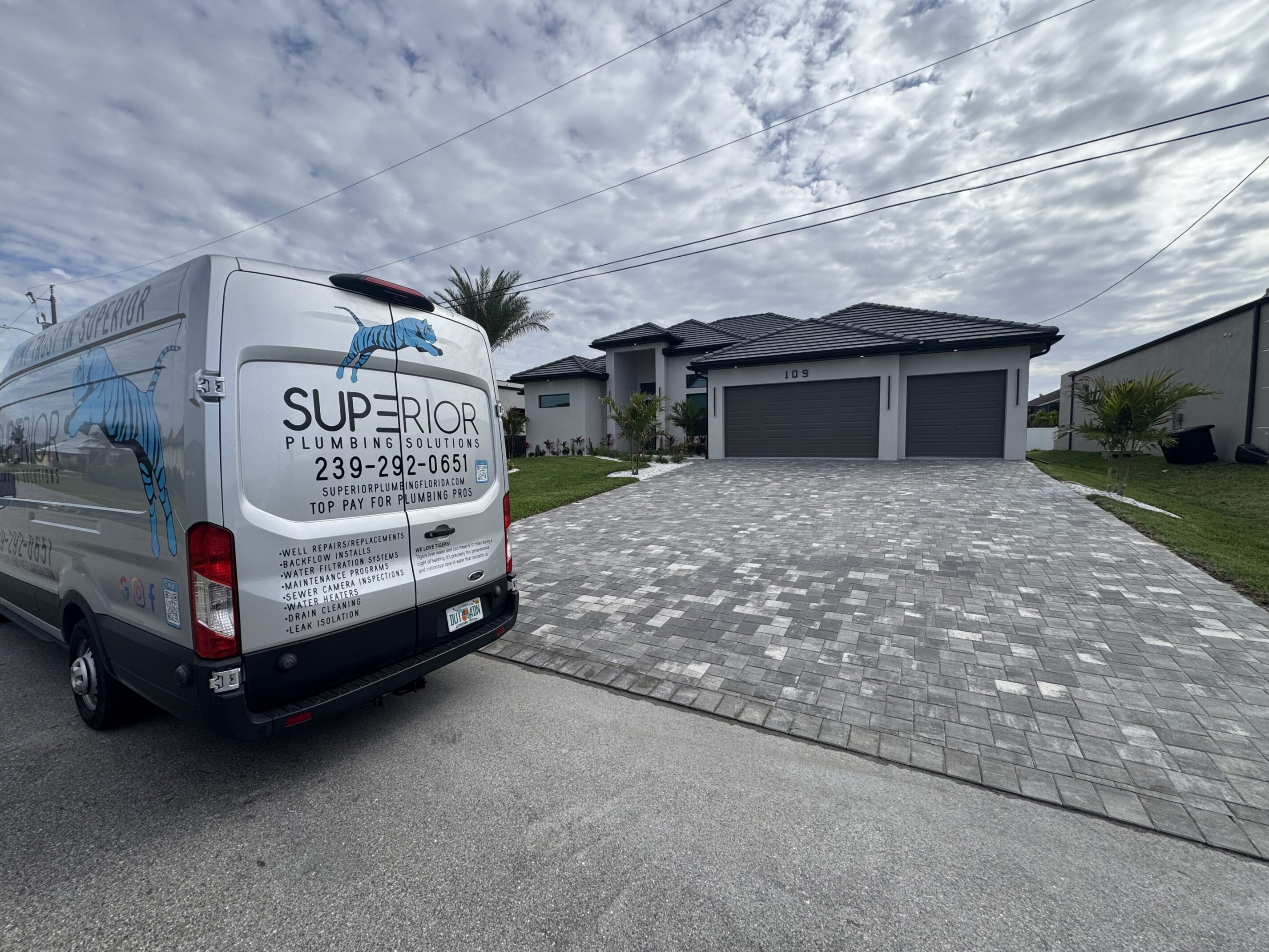 Superior Plumbing Solutions van parked in front of a home in Cape Coral Florida
