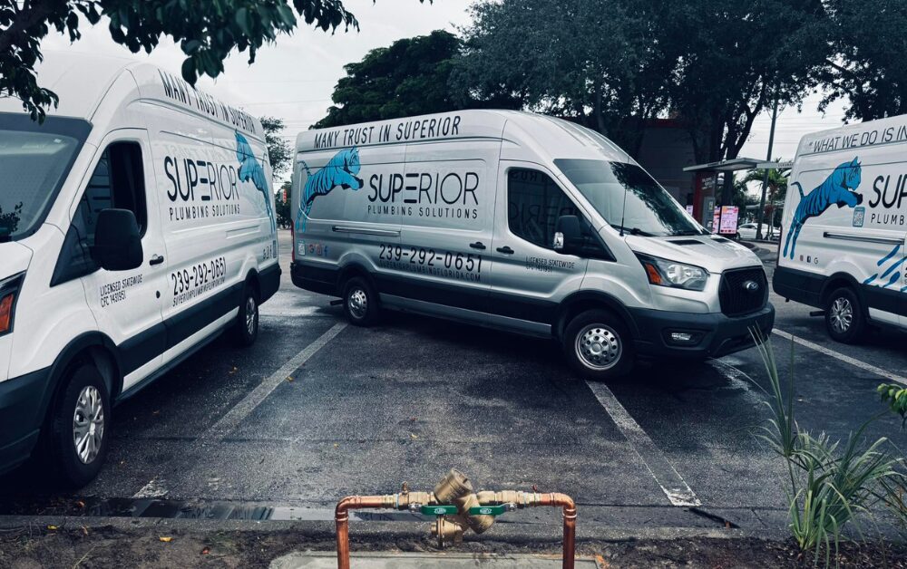 Fleet of Superior Plumbing Solutions service vans lined up and ready for dispatch to residential and commercial plumbing jobs in Cape Coral, FL.