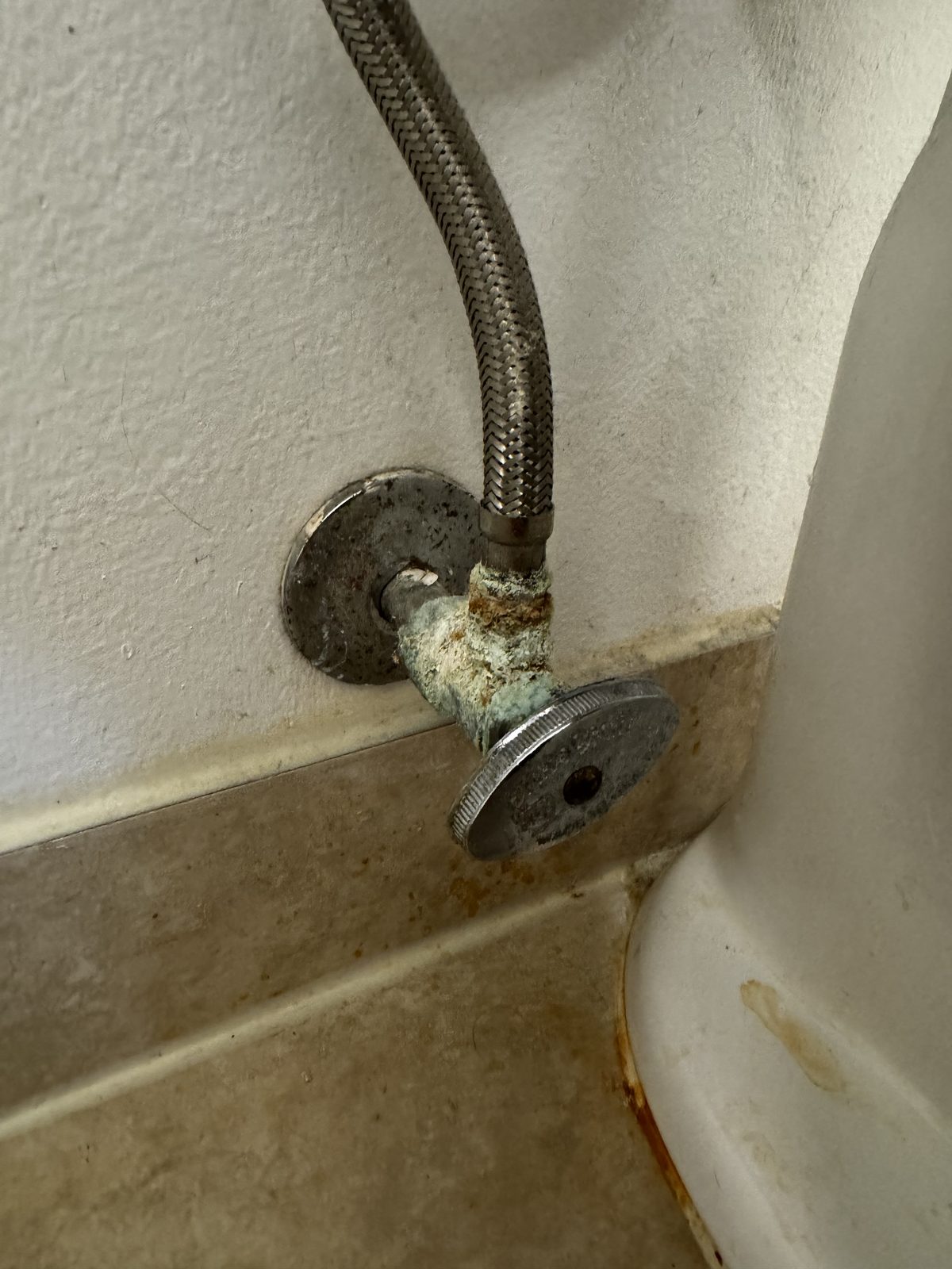 Corroded angle stop shut-off valve with heavy mineral buildup before replacement in Cape Coral, FL.