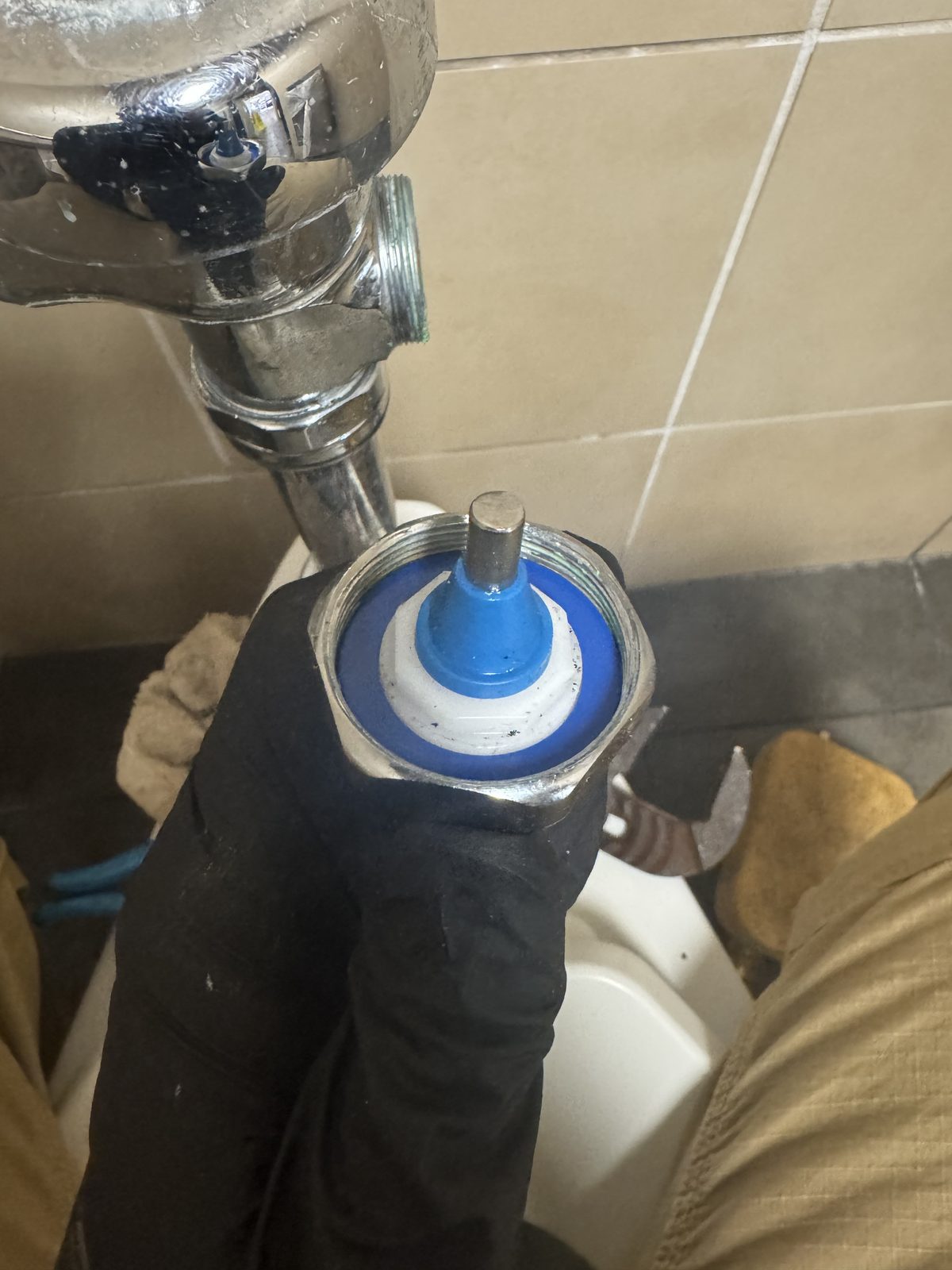 Rebuilding a chrome flushometer toilet flush valve with a new diaphragm kit in Southwest Florida.